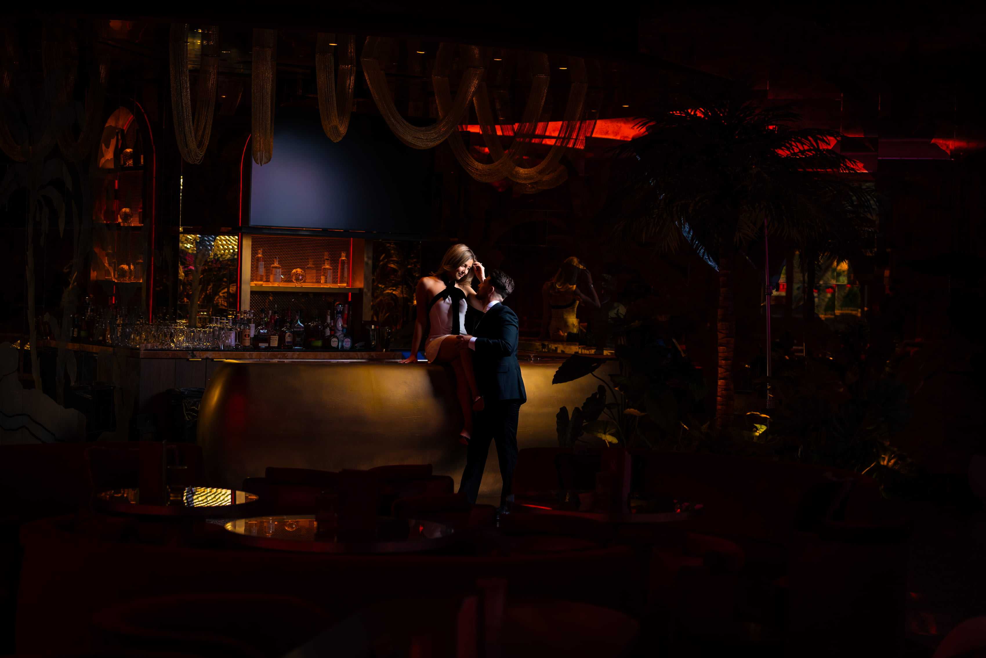Stylish couple posing at the bar inside Rouge Room at Red Rock Casino Resort in Las Vegas